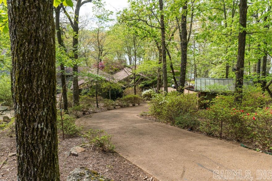 LAKEFRONT HOME on EDEN ISLE!!!  This wonderful 5-bedroom, 5-bath home is perfect for a large family or two families!  Mostly furnished, high-end kitchen appliances, 3 livings areas, 2 wet bars, great deck with a section that is screened and covered, 2-car portico, work-out room, laundry room, large stone fireplace, golf cart garage and much more.  This home is in absolutely perfect condition!  5 minute cart ride to Eden Isle Marina!