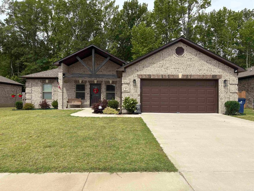This stunning 4 bedroom, 2 bath home offers the perfect blend of modern design and everyday comfort. The open concept layout is ideal for entertaining. Split bedroom floorplan provides privacy and space for everyone. You'll love the light neutral colors and natural sunlight in this home. Step outside to the large covered back patio, perfect for relaxing or hosting. And this home backs up to a quiet wooded area providing extra privacy. Well-kept, friendly neighborhood perfect for your family! Agents, see remarks.