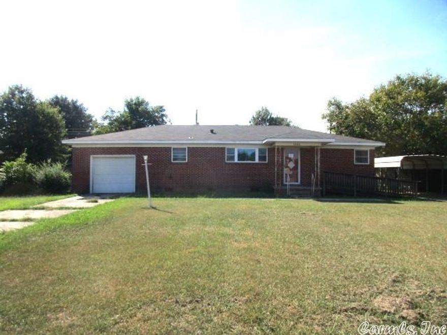 Brick home by school.  This 2 bedroom, 2 bath home has a huge backyard with storage building.  Single garage and also a carport.  See Agent Remarks**
