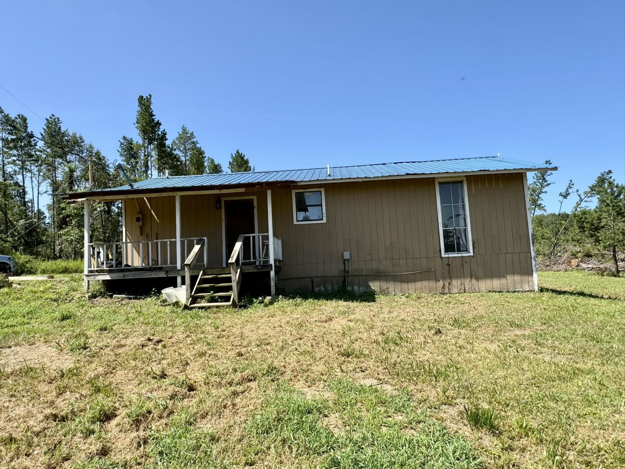 2 Bedroom, 1 Bathroom Home on 5 acres! This property has a large open yard with endless possibilities! Great property for a homestead at an affordable price! Home has a large kitchen open to the dining room and living area. Two spacious bedrooms, full bathroom, and a large mudroom/laundry room. Home is being sold AS IS!