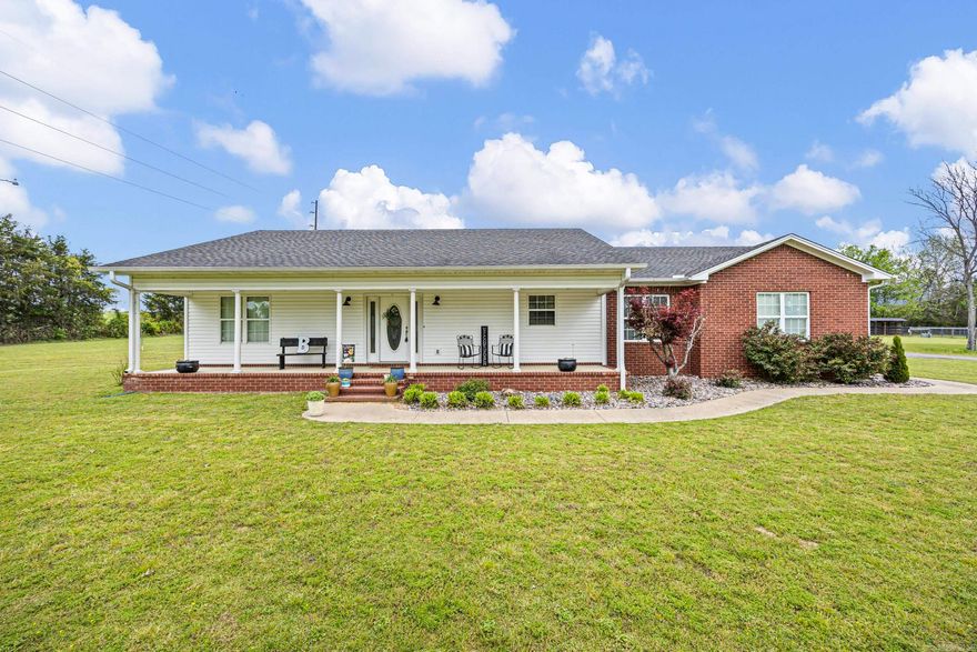 QUALITY CONSTRUCTION AND COUNTRY CHARM CLOSE TO TOWN!! Help me welcome this well-built home that sits on 2.75 beautiful acres and offers the perfect blend of comfort and charm. Inside, you’ll find a spacious 3-bedroom, 2-bath split floor plan with wood flooring and a bright kitchen featuring new Corian countertops. The living area is accented with elegant crown molding, adding a touch of character throughout. The nicely sized primary suite includes an updated bathroom with a walk-in shower for a modern, comfortable retreat. Step outside to enjoy mature trees, a peaceful pond complete with a charming wooden dock, and plenty of room to roam. The property is fully equipped with a 20x30 metal shop, a brand-new RV carport, and a barn shelter with fencing! This property truly has it all, space, functionality, and scenic surroundings! Call today!!