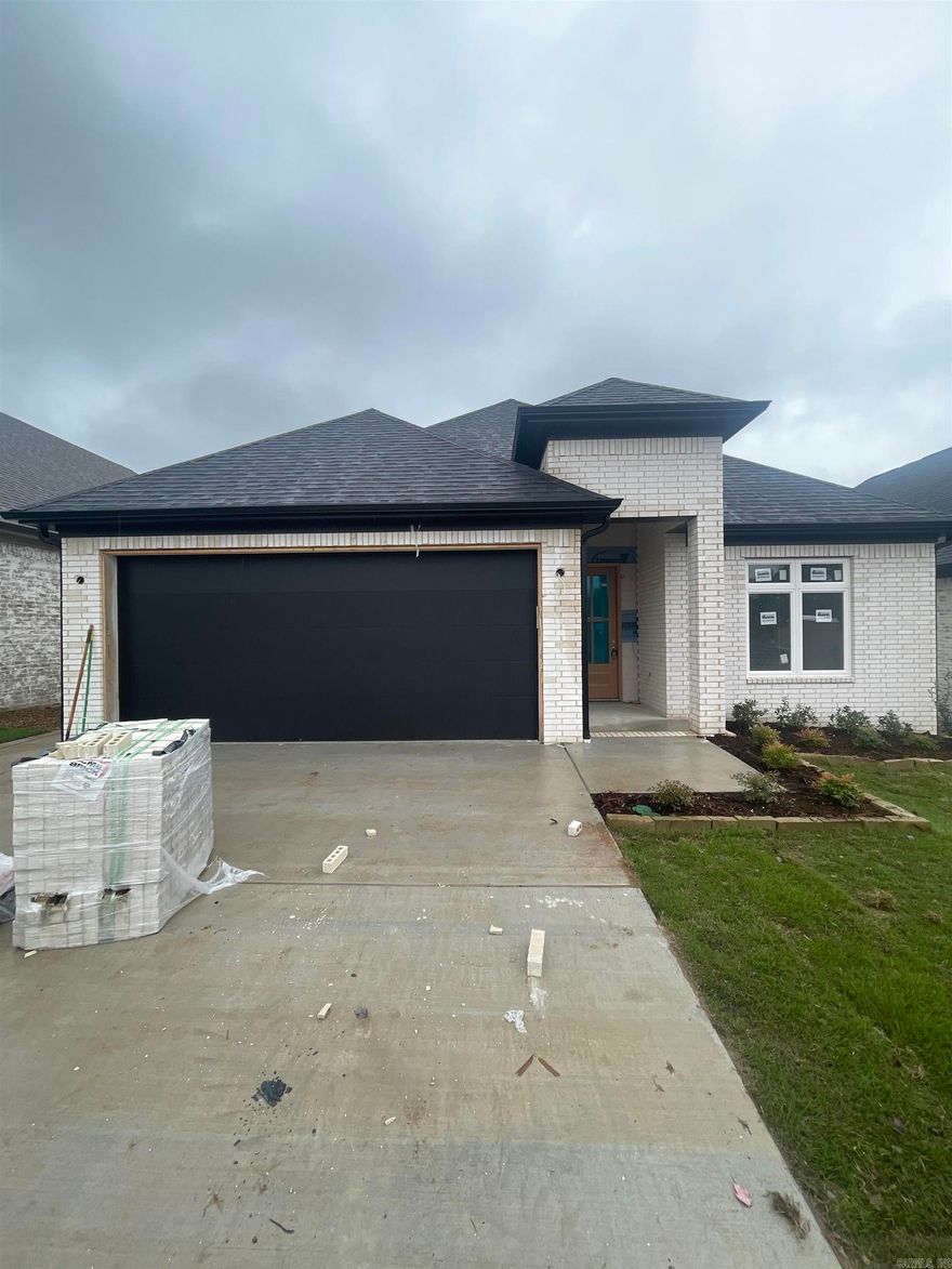 Nestled among lush landscaping and mature trees, the Fletcher Valley community offers a peaceful and private retreat, yet it's just moments away from your favorite shopping and dining spots in West Little Rock. This cozy single-level home features 3 bedrooms and 2 full bathrooms with a layout that’s both functional and inviting. The primary suite is your own little haven with a soaking tub, a large walk-in shower, and a custom oversized closet. You'll love the designer finishes and the top-notch craftsmanship throughout. If you enjoy entertaining, the open-concept layout and formal dining room are perfect for gatherings, and the chef's kitchen with quartz counters and custom cabinetry is sure to impress. Combining style and practicality, this home will be ready by December 2024, just in time for you to make it your own. Pictures are from a similar floorplan