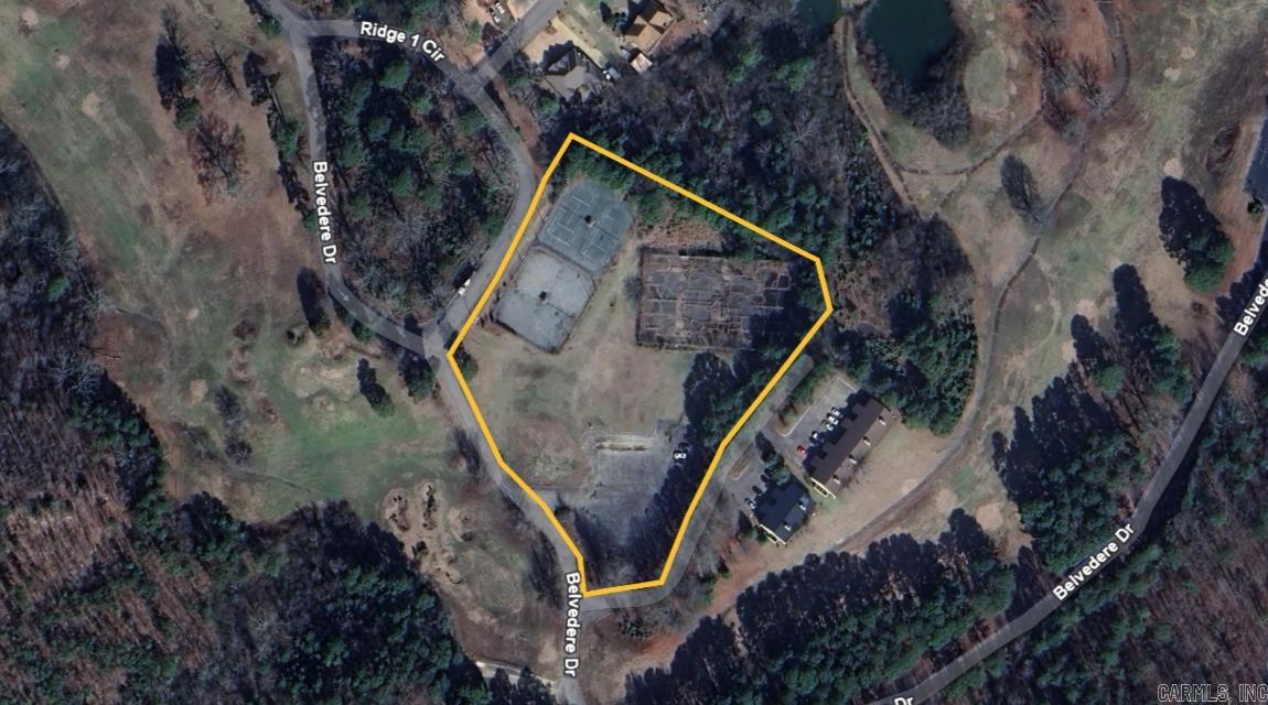 Unlock the potential of this unique commercial property—formerly home to a full-size tennis court complex. The site offers a rare opportunity for redevelopment into a modern tennis or pickleball facility, recreational center, or reimagined for other commercial uses. With ample existing paved parking, the groundwork is already in place for a variety of projects. The courts will need to be resurfaced or replaced, but the location and layout provide a strong foundation for future development. Ideal for investors, sports facility operators, or entrepreneurs seeking a flexible-use property.