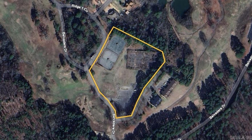 Unlock the potential of this unique commercial property—formerly home to a full-size tennis court complex. The site offers a rare opportunity for redevelopment into a modern tennis or pickleball facility, recreational center, or reimagined for other commercial uses. With ample existing paved parking, the groundwork is already in place for a variety of projects. The courts will need to be resurfaced or replaced, but the location and layout provide a strong foundation for future development. Ideal for investors, sports facility operators, or entrepreneurs seeking a flexible-use property.