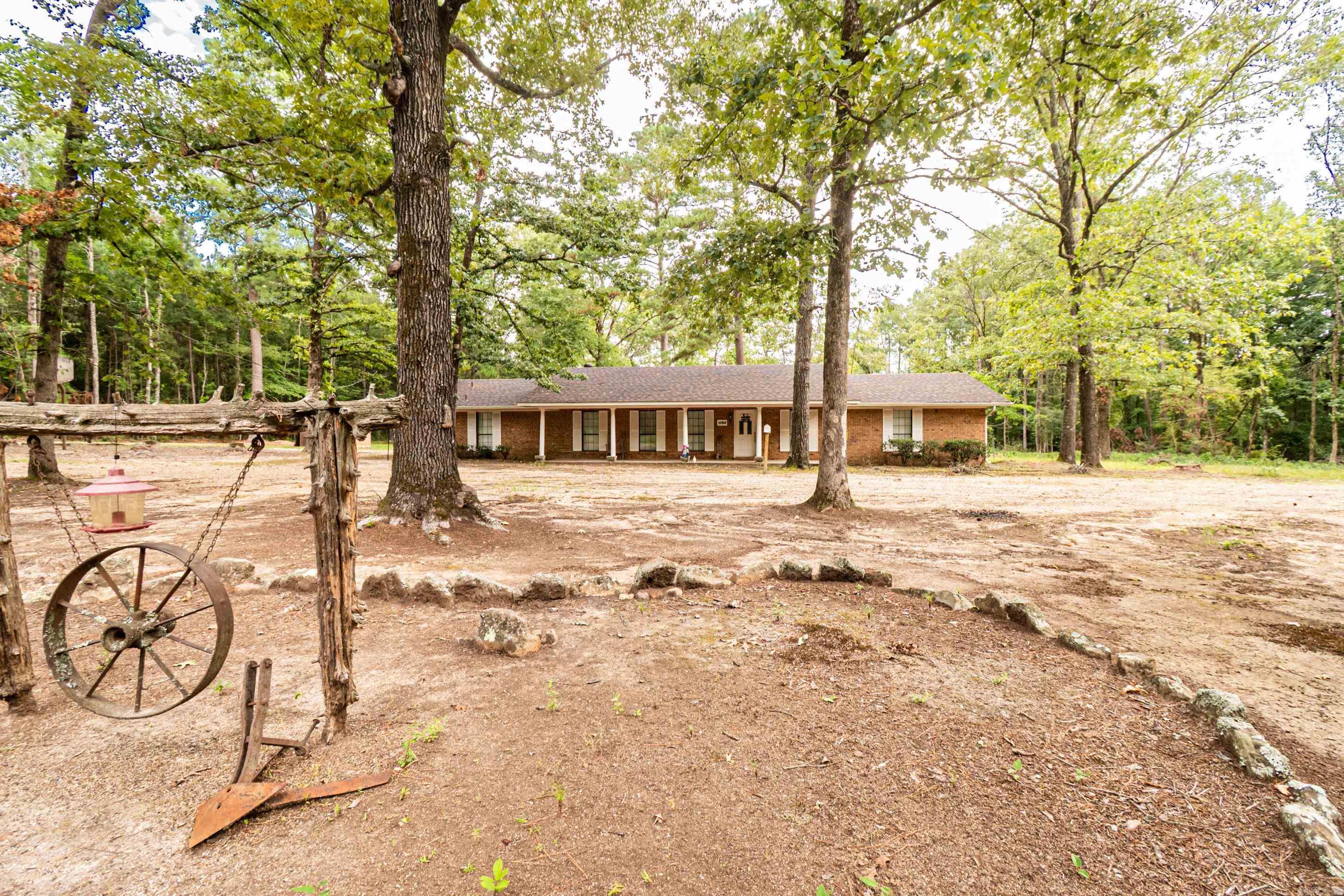 Escape to the peace and privacy of the countryside with this spacious 3-bedroom, 2.5-bath brick property situated on 6 beautiful acres just outside of Bearden. With over 2,300 square feet of living space, this home offers room to grow, work, and relax. Inside youāll find a large living area, generous bedrooms, and an additional room that can serve as a fourth bedroom, office, or hobby space. The laundry area includes a convenient half bath. Outdoors, enjoy plenty of parking and open space for entertaining, gardening, or simply enjoying the view. This property gives you the best of both worldsāseclusion and serenity while still being minutes from schools, shopping, and dining. Whether youāre looking for a peaceful retreat or space to spread out, this property is a perfect fit.