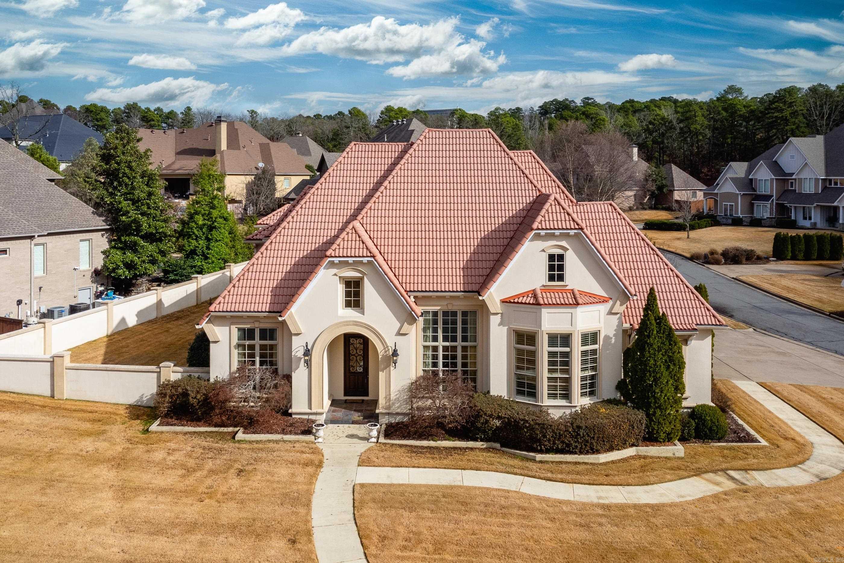 Stunning custom home with gorgeous flooring, tall ceilings, beautiful trim work and decor finishes! Plenty of room for living & entertaining thru-out in this fabulous floor plan. Formal living & dining areas off foyer with soaring ceilings. Spacious office with built-ins & coffered ceiling. Fantastic gourmet kitchen features custom cabinetry, top of the line stainless appliances, gas cooktop and exquisite granite countertops. Luxurious Primary suite is huge with spa bath & closet, as well as a guest suite on main level. Impressive living area off kitchen features gas log fireplace, informal dining and lots of natural light. Upstairs are 3 guest bedrooms 2 baths, true media room and game room with wet bar. 3 car garage, plantation shutters, abundant storage. Come see!