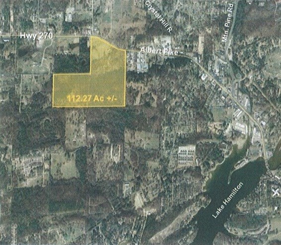 Priced well below Appraisal! Over 112 acres with 1400 ft. of Hwy 270 W. frontage across the street from the new Garland County Jail. just outside the city limits with 3 ponds, gentle rolling hills of pasture and timber totally fenced. Would make a great place for an estate home, ranch or commercial development.
