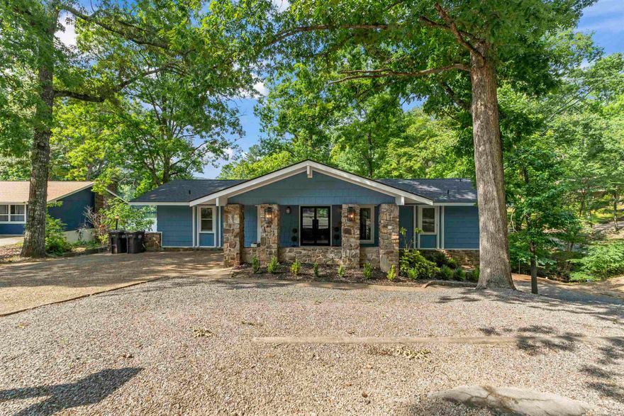 WOW! Totally updated Lake front home on Lake Desoto! 2 Living areas, gorgeous kitchen and breakfast area, 3 Bedrooms, 3 Bathrooms plus a workshop room or crafting room (currently used as a bunk room for a 4th bedroom.) Perfectly positioned for a lovely view straight down the cove with 2 large decks to enjoy it! Large corner lot with common property in the back and almost 60' water frontage! Don't miss the opportunity to come see this beauty for yourself!  Fully remodeled in early 2022, the main floor has the kitchen, breakfast room, and living room that walks out on a spacious deck overlooking the lake, a full bath, and main bedroom. Downstairs is another spacious living area, two bedrooms, 2 full baths, laundry/ bunk or bonus room, and a 2nd deck for your enjoyment. You will experience gorgeous views and plenty of space both inside and out! Seller will consider selling completely furnished. Experience the charm of Hot Springs Village living with restaurants, medical, shopping, 9 golf courses, 11 lakes for boating/fishing, 30 miles of walking trails, tennis, pickle ball, playgrounds, and more. Whether you’re looking for relaxation, recreation, or both – it’s all right here.