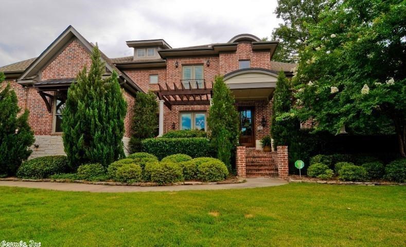 This is gorgeous custom home w/ incredible attention to detail ! You will find something special at every turn! The kitchen is a chef and entertainer's dream w/top of the line appliances, granite, large breakfast bar, wine room, open floor plan that flows to a screened patio & outdoor patio w/a fire pit for these wonderful Arkansas evenings. Rich wood paneling wraps the walls and ceiling of the study, & an arched, plank wood ceiling in the hearth rm. Amazing trim-work throughout! MUST SEE!