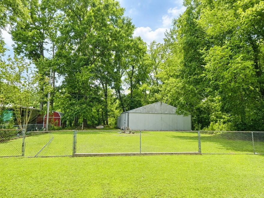 Riverfront Property with Airplane Hangar & Landing Strip Access  Rare opportunity to own a riverfront lot with aviation convenience! This fenced property features a massive 40' x 163' airplane hangar and is located directly across the road from a landing strip, making it ideal for aviation enthusiasts or those needing substantial storage space. A septic system is already on the property, though it has never been connected. Enjoy riverfront access, wide-open possibilities, and a unique combination of waterfront living and aviation convenience.