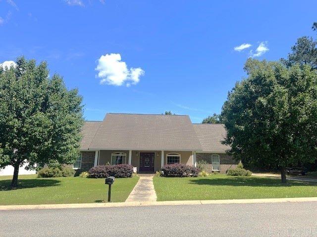 Beautiful home in a great location! This home is in close proximity to just about everything. Minutes from UAM, schools, hospital, doctors and the main highway through town. You'll love the kitchen with large picture window, gas Jenn-Aire stove, granite tile countertops, island with bar stools that will convey, abundant cabinet space, dishwasher, and refrigerator will also convey. Formal dining and living room both access the kitchen. Formal Spacious primary bed and bath with jetted tub and separate shower and access to the back porch. 3 additional bedrooms and 2 baths provide plenty of space for your family and/or guests. There is a separate home office or den/playroom. Upstairs you'll find a bonus space, perfect for storage or could be used as an additional bedroom if needed. A double garage attached, as well as a detached double carport with workshop/storage/hobby room. Fenced backyard and covered patio to round out this property. Call today for an appointment to see this lovely home. Seller requests a 24 hour notice.