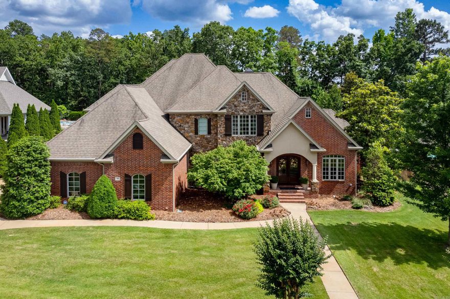 Marvelous family estate home in beautiful gated Deauville Place. Two story foyer showcases striking curved staircase, detailed millwork and new hardwood floors. Natural light floods through from floor to ceiling windows in formal living area with marble surround gas FP and views of the inground pool, patios and lovely fenced yard. Office/study and formal dining off foyer. Fantastic kitchen with top of the line appliances, prep areas, huge center island breakfast bar, great pantry and informal dining. Family room/den with gas FP overlooking outdoor entertaining area. Primary suite with sitting area and huge spa bath with lots of storage and built-ins. Upstairs are 2 spacious BDRM suites, guest BDRM with hall bath and Bonus/media Room. 3 car side load garage with storage. So much more! Come See!