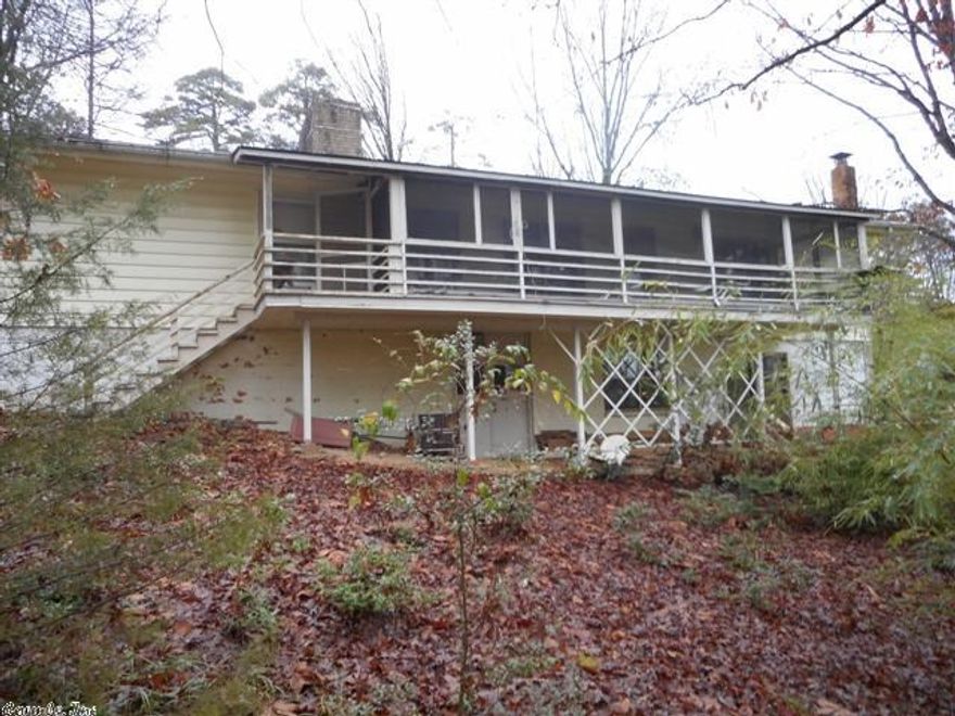 NEW PRICE!!!  Don't miss out on this great space buy located in the heart of Hot Springs Village.  This home is close to parks, golf, fishing, and retail.  Home features two living areas, a woodburning fireplace, screened in porch, and a large basement with a wet bar area.  Please see agent remarks.  Seller pays commission on the Net sales price, not the Gross.