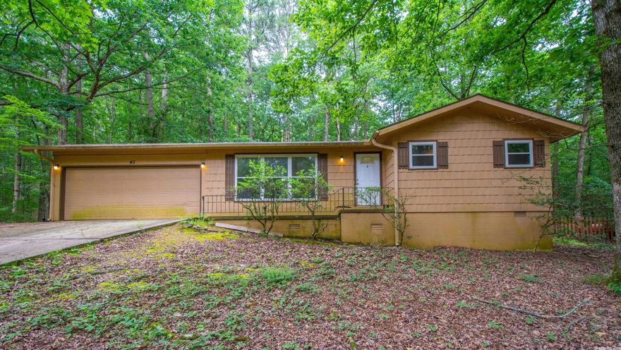 Great 2 bd 2 bath home in Hot Springs Village.  Sunroom with wood burning fireplace.  Patio in rear of home.  Tree shaded lot. Great starter home or investment property.  CASH ONLY.  AS IS IN PRESENT CONDITION.