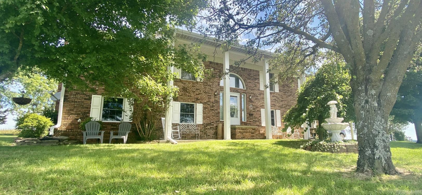 Welcome home to this beautiful four bedroom three bath all brick home with amazing views of the Ozark Mountains and the surrounding farm land. Enjoy sunrises and sunsets from the porches and decks that surround the home. A well manicured yard with very tasteful landscaping really gives this place it's country charm. The location is pretty great also. Your own little piece of heaven and seclusion without having to maintain a lot of land. It's just a short drive to Greers Ferry lake or Mountain View so you can enjoy the lakes, rivers and music of the Ozarks. On the inside there are three bedrooms and two bathrooms on the main floor with the kitchen and living room with a den and second master bedroom on the lower floor. There is a two car garage with laundry room that is heated and cooled as well as a small shop on the property. With three different heat sources with central electric heat , a wood furnace and gas long fireplace you will never be cold here. This is one you need to check out! Give a call today to schedule a showing!!
