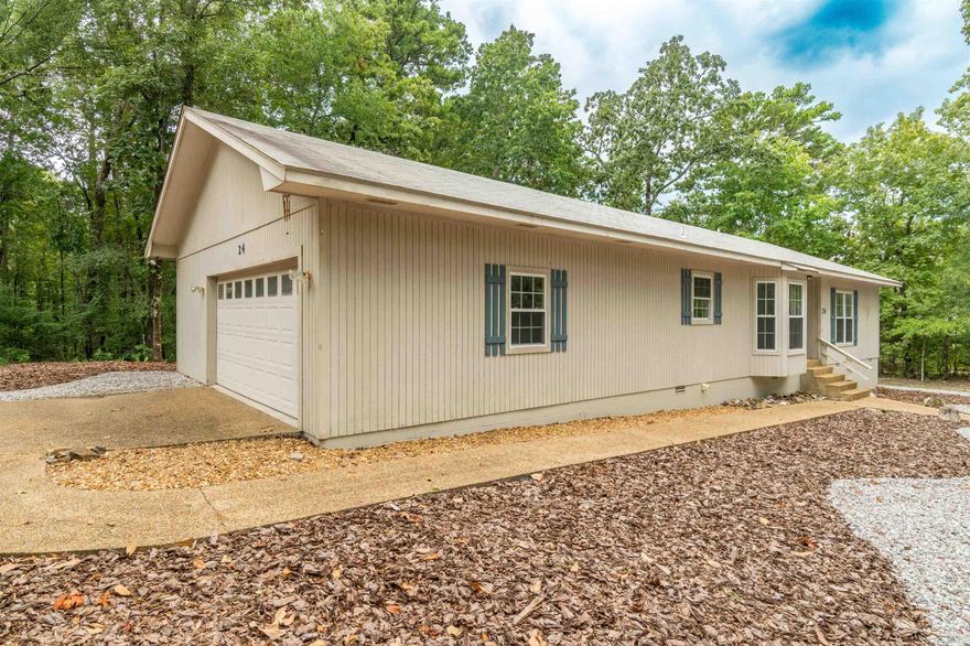 Discover easy Village living. This remodeled 2-bedroom, 2-bath home offers comfortable living with a bright sunroom, gas log fireplace, and an open kitchen/dining combo featuring granite counters. The fenced backyard is perfect for pets or peaceful evenings outdoors. Situated on a level lot with a two-car garage, this home blends convenience and charm. Take advantage of the Village lifestyle with golf courses, lakes, trails, and more just minutes away. AGENTS SEE REMARKS.