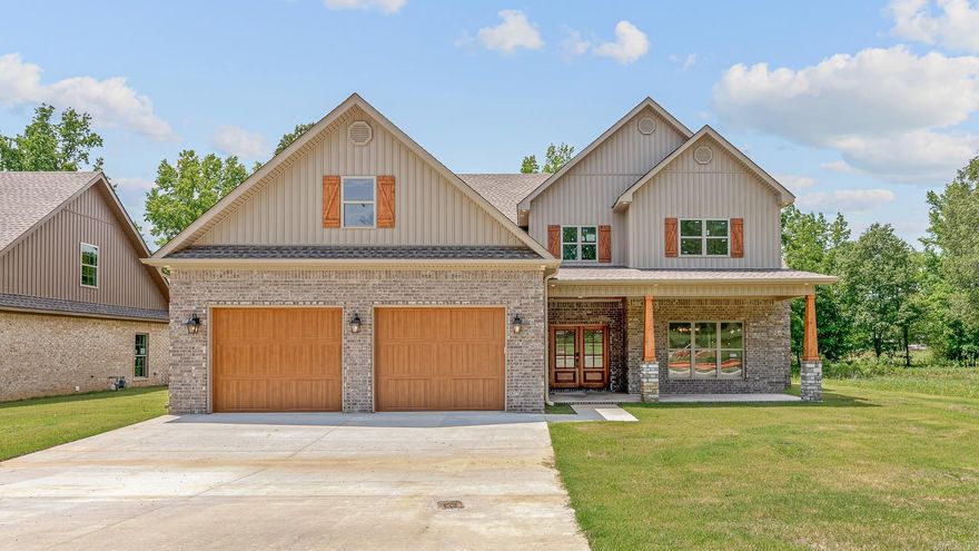 Luxury new construction located south of the bypass in Jonesboro, AR within the Jonesboro School District. This home offers approximately 3,830 sq. ft. of living space with 4 bedrooms, 3.5 baths, and a bonus room. The master suite includes double glass doors leading to the back porch. The kitchen is designed for entertaining with granite countertops, a 9’x54” island, Bosch appliances, and a formal dining area. The living room features a vaulted ceiling with a stylish fan and a floor-to-ceiling gas log fireplace. Bedrooms include oversized walk-in closets. An upstairs balcony overlooks the spacious living area, adding to the open feel. Outdoor living is enhanced with stamped concrete and a tongue-and-groove ceiling on the porch. Energy-efficient construction with R38 fiberglass blown insulation provides year-round comfort. This is a new construction home, however some of the listing photos have been virtually staged to show what the home could look like with furnishings!  This home is move in ready and easy to view anytime.  Call today to take a look in person!