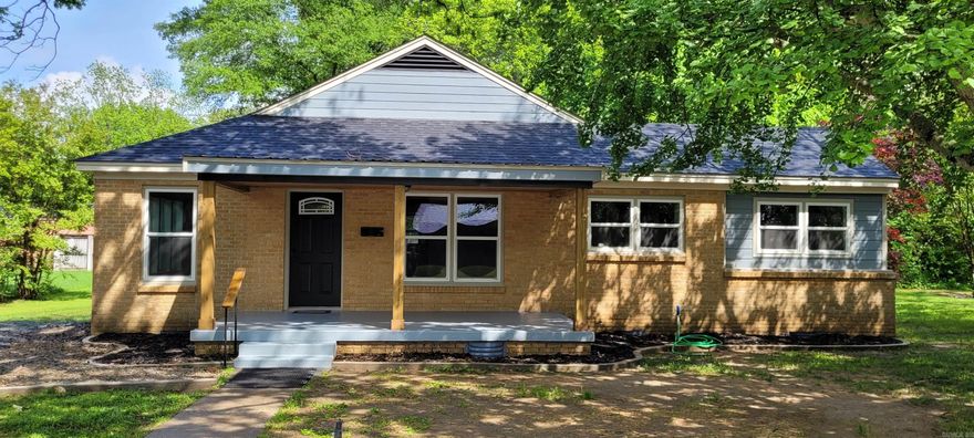 COMPLETELY REMODELED 3 BR 2 BA HOME - This one is move-in ready. Everything has been replaced top to bottom. New roof, windows, floor joists, plumbing, electrical and literally everything in between! Bright white cabinets with soft-close doors and drawers, neutral granite countertops, glass tile backsplash, and brand new appliances in the kitchen. Interior features include durable waterproof laminate wood flooring throughout with beautiful modern patterned tile in both bathrooms, spacious laundry room, and several storage closets. The 10x20 covered front porch and wooden back deck on the brick and hardie board exterior steal the show outside. Concrete flower bed borders and new mulch have been added along the front for even greater curb appeal. There's nothing left to do besides customize the landscaping with some beautiful flowers and decorate those freshly painted walls!