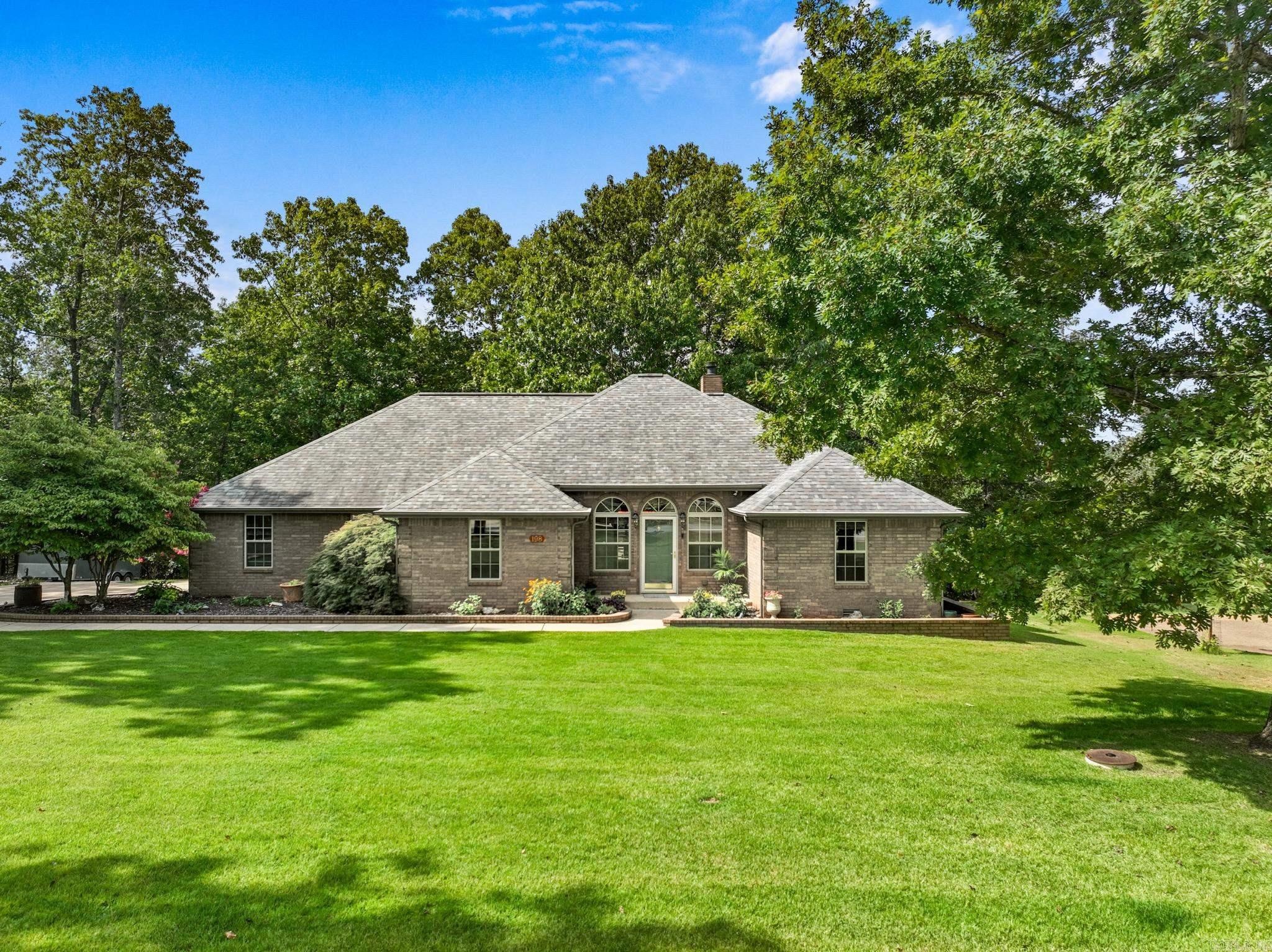 Welcome to this beautiful brick home in the sought-after Breckenridge subdivision! Offering 4 bedrooms and 2.5 baths, this split floor plan blends style and function. The large kitchen features stained cabinets, granite countertops, and a gas range, with both a breakfast nook overlooking the back deck and a formal dining space. The inviting entryway opens into a spacious living room with a woodburning fireplace and wet barāperfect for entertaining. The primary suite boasts a luxurious en suite with a corner soaking tub, walk-in shower, and an oversized closet. A huge back deck looks out to peaceful woods, and the finished epoxy-floor garage and accessible walk-in crawlspace provide tons of storage. With its prime location and thoughtful upgrades, this Breckenridge gem is ready for you to call home.