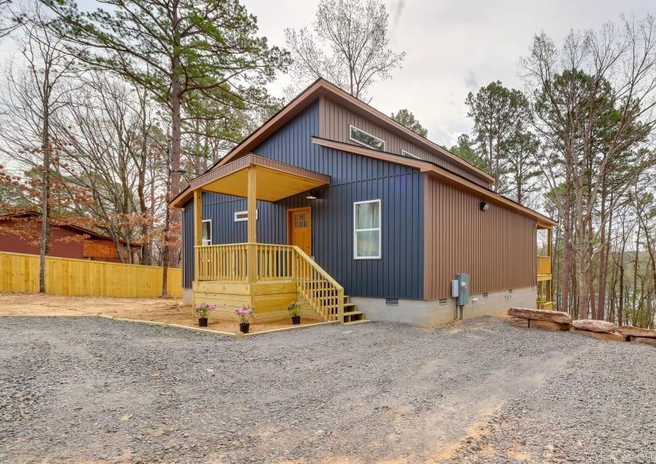 Welcome to your dream lake front getaway! This unique property features two fully furnished cabins on a single, expansive lot. The main cabin has three bedrooms, two bathrooms, and a loft with bunkbeds. It boasts an open-concept living area with a cozy fireplace, large windows, and a fully equipped kitchen. The secondary cabin offers a private retreat with one bedroom, one bathroom, and a kitchenette. Enjoy serene surroundings with beautiful landscaping, a fire pit, and ample outdoor space. Nestled in a tranquil setting yet close to local amenities, this versatile property is perfect as a primary residence, vacation home, or investment opportunity. Schedule a viewing today!
