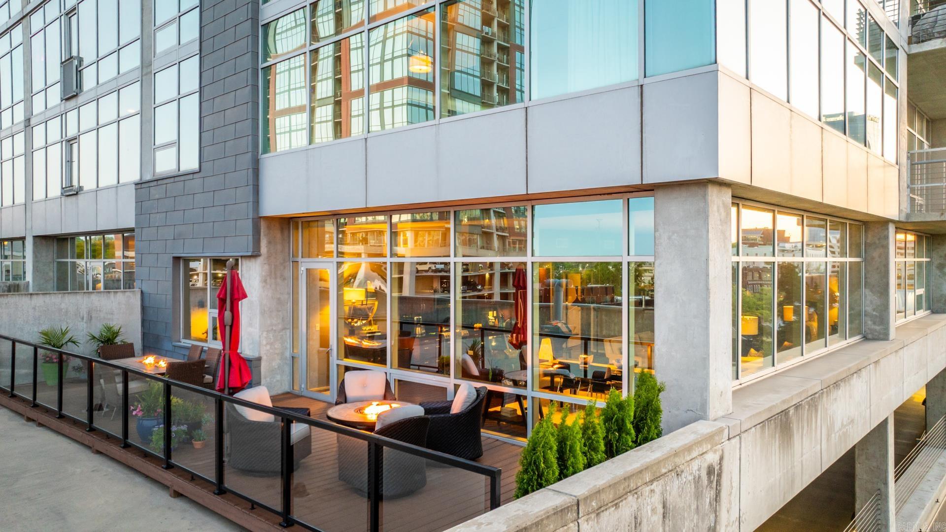 Welcome to your dream condo in the heart of Downtown Little Rock. With panoramic views, spacious living and an incredible patio space unlike anything on the market. Entertain all year long with 400+ sq ft of decked space for grilling, gardening or your pets! This NE corner unit offers ample storage space, oversized bedroom suites with two updated bathrooms and a separate laundry room. The kitchen is the perfect gathering space to host dinner while enjoying the fireworks or a glass of wine after a concert. Building amenities include concierge, pool, fitness room, bike storage, hot tub and rooftop party room. Condo includes two reserved parking spaces. On site storage unit available to purchase. Agents see details for more information.