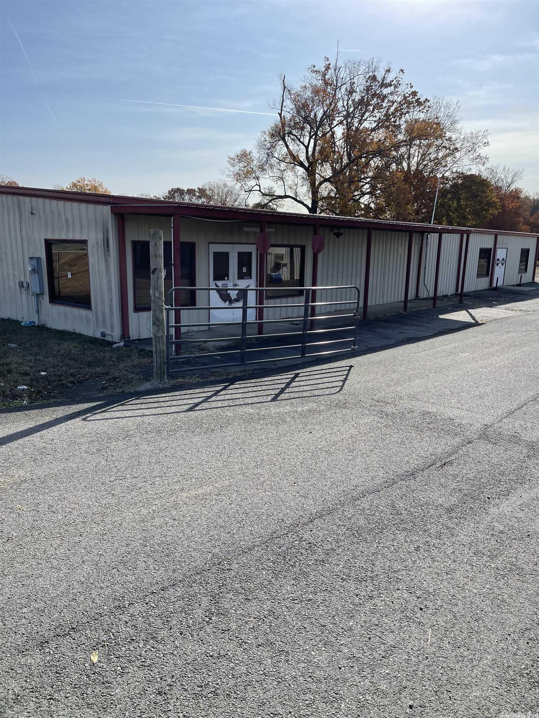 This property has many possibilities! It has a large building that could be used for retail space. 3 buildings with mini storages. Great location in a high traffic area, sitting on 2.92 acres. See Agent Remarks!