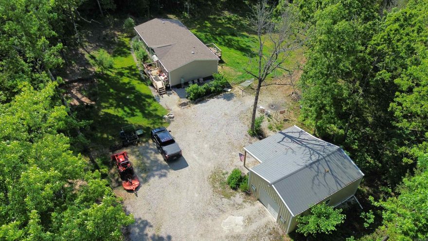 This secluded 3-bedroom, 2-bathroom manufactured home was built in 2021 and is situated on 10 beautiful acres in Oxford, Arkansas. The property offers a perfect blend of cleared and wooded land—ideal for enjoying nature, recreation, or small-scale homesteading. The home is solidly built with 6 inch insulated walls for excellent energy efficiency and has been well cared for. There is a spacious and functional layout that includes a den/family room, bonus room, and laundry room. The kitchen comes fully equipped with appliances, and the home also features central heat and air, public water, septic system, and a crawl space foundation. A termite contract is already in place, adding peace of mind for the next owner. What truly sets this property apart is the incredible workspace and storage potential. There’s a 24x25 detached garage with an electric door opener and insulated ceiling, a 20x30 workshop with two garage doors, and an additional 24x25x11 garage with lean-to—perfect for projects, hobbies, or equipment storage. Whether you need a place for tools, vehicles, or a home-based business, this setup is ready to go. Priced at $263,900—call today to schedule your private showing!