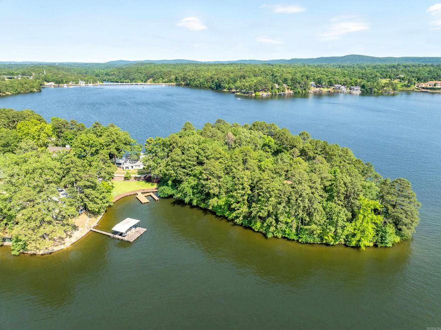 ONE OF THE LAST POINTS ON BEAUTIFUL LAKE HAMILTON, HOT SPRINGS, ARKANSAS--OVER 900 FEET OF SHORELINE WITH 1.80 ACRES TO BUILD YOUR DREAM HOME.  NESTLED IN A HIGHLY DESIRED AREA, WATCH SUNRISES & SUNSETS WITH VIEWS OF CAPENTER DAM, GARVAN GARDENS & MAIN CHANNEL. THIS RARE OFFERING WITH MATURE TREES SETS THE STAGE FOR AN ESTATE LIKE NO OTHER.  MAKE YOUR APPOINTMENT TODAY TO VIEW THIS OUTSTANDING PROPERTY.