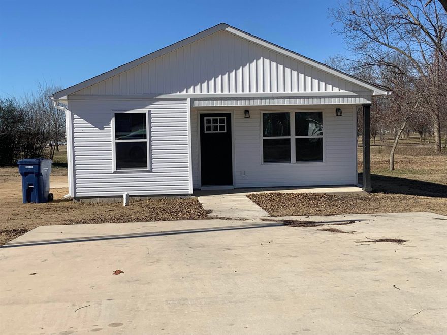 Beautiful 3 br, 1 bath home, looks like NEW!  LPV flooring through out, boxed ceiling in Living room. Kitchen/dining combo, Custom white cabinets with Black/Stainless appliances.  Laundry behind double doors in Kitchen.  Bath with tub/shower combo. Ceiling fans.  Double parking pad in front of house