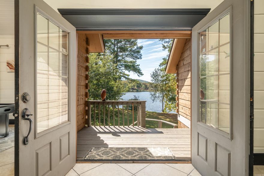 This exclusive private peninsula offers a rare opportunity to own a gated retreat in one of the most sought-after lakefront locations. Currently operating as a highly successful short-term rental, the property generates well over six figures annually.  Two of the homes each feature three bedrooms, providing ample space and comfort. The smaller cabin has 1 bedroom and is perfect for a quick getaway! The Bus includes one bedroom and one bathroom, with an additional RV hookup available. A fourth shed-style structure is currently used for storage but has the potential to be converted into a tiny home. There is room on the property to develop another cabin or to add another stylish Bus!  The property boasts exceptional water access and views with a two-slip covered boat dock with a swim deck, a separate swim dock, and a pier. Offering unmatched privacy and stunning lake views, this unique investment opportunity is perfect for those seeking a profitable rental or a private waterfront escape.
