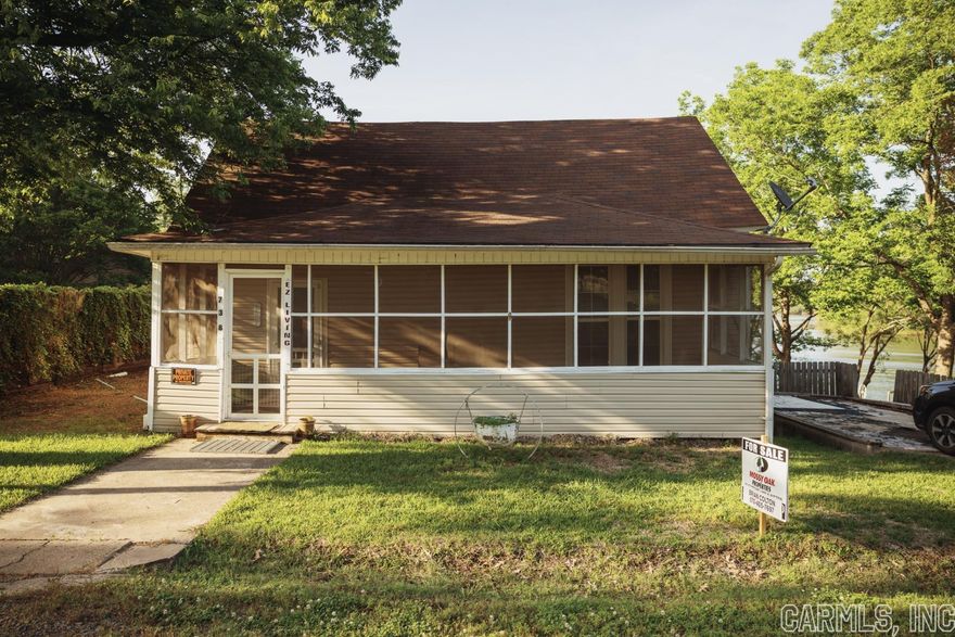 216' x 100' Lot with House, Guest House, Storage Building, Boat Dock, Game Station.  With 81" x 99' Lot Across the Street with Circle Drive and Storage Building with Boat Motor Rack. Fenced with Locking Gate.