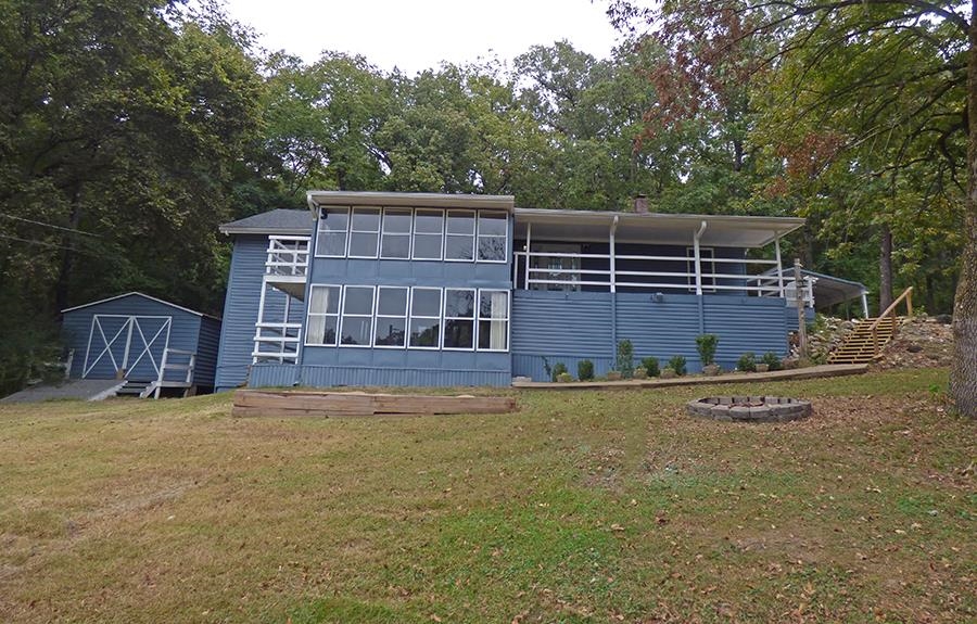 South Fork of the Spring River Property Paradise - This property boosts of a house with over 3,200 square feet of living space on 2 levels, a gorgeous cabin that can produce rental income, and 7 vacant lots with 3 having frontage on the South Fork of the Spring River. The total amount of land is 1.2 +/- acres. The house offers 4 bedrooms & 3 baths. Main level has living room with a gas log fireplace, kitchen with stainless steel appliances, utility room, Laminate wood flooring, vinyl windows & enclosed deck. The lower level has a family room, bedroom, bath, plenty of storage space & enclosed deck. House is on over a half acre lot. The cabin is 577 square feet with living/dining room, kitchen, bedroom and full bath. The 7 vacant lots are across the street from the cabin side by side to the river.