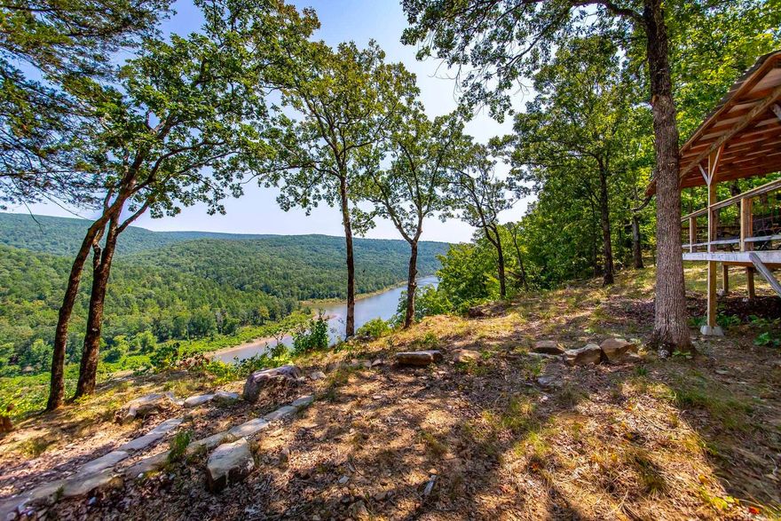 Gorgeous Lake & River views with a newly built 288 sq.ft. metal cabin w/ well water, septic, and power. Enter this beautiful piece of paradise and enjoy the peaceful and tranquil views of Greers Ferry Lake & The Middle Fork Little Red River. The cabin features a wrap around deck, inside features tall ceilings, small kitchenette, propane stove, and 1/2 bathroom. Rv Hookup! There are multiple options one could do with this property : use the cabin as it is, expand and make it bigger, build cabins for vacation rentals, homestead the land, or make it whatever you want. There is a deer stand on the property that will convey. This property will not disappoint. There are no restrictions. Call today to schedule a tour.