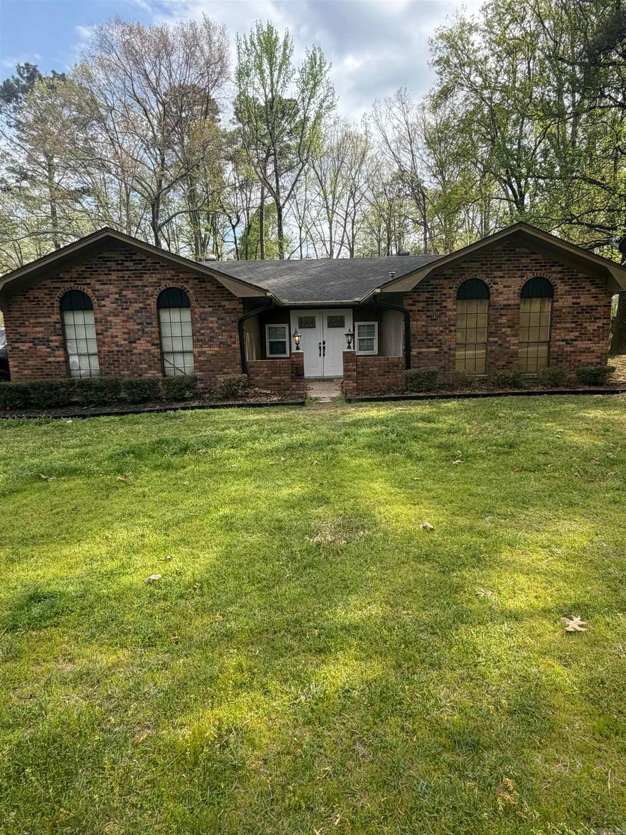 Welcome to this charming 3-bedroom, 2-bath home offering comfort, space, and versatility. The spacious living room features beautiful flooring and a cozy fireplace, perfect for relaxing or entertaining. The kitchen includes stainless steel appliances, ample cabinet space, and a dedicated dining area for everyday living. Each bedroom offers great natural light and comfortable space, while both bathrooms are well-maintained. A standout feature is the bonus room located at the back of the home—ideal for a home office, playroom, gym, or additional living space to fit your needs. The home also features a functional laundry area and a classic brick exterior that adds to its curb appeal. Enjoy the large yard, perfect for outdoor gatherings or quiet evenings at home. Move-in ready with plenty of potential to make it your own—schedule your showing today!