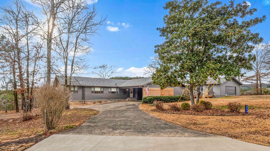 BREATHTAKING VIEWS OF GREERS FERRY LAKE & LYNN CREEK greet you as you enter this stunning home & you are drawn to the back glass wall of windows!  There are views, & then there is THIS IMPRESSIVE VIEW!!!  And you'll be impressed with an abundance of updated features throughout.  To name a few in the past 2 yrs:  270 sq. ft. addition, new Master Bath with custom walk-in shower;  Large Guest bath with new shower & a slipper tub; wood ceiling in greatroom; hardwood floor in greatroom & hall; remodeled kitchen; new Geothermal h/a system; New roof, New huge deck offering that awesome lake view; a new small deck attached to garage; elec. panel & heating unit for hot tub.  Did we mention the new stairs built to water's edge?  A Brio firepit?   What else could you want for your resort residence or lake retreat?  3 BR & a sleeping nook, a 4-season room with view! 2 baths & great laundry/mud room.   The lot is over 1 acre (back corners below water!) with a large detached garage plus carport & sprinkler system. More details & survey available. The lake view at this location cannot be matched, & the price for this amazing property creates  the Dream Home Come True that you are looking for!!!