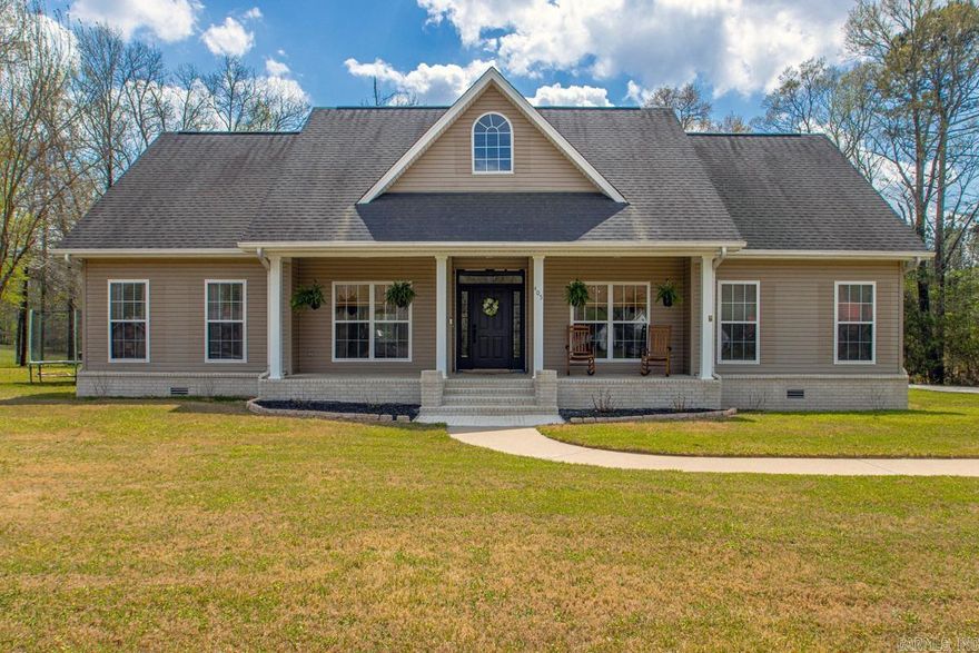 Welcome to 405 W. Elm Street in Haskell, AR! This beautiful 3 bedroom/ 2.5 bath home sits on a gorgeous 1.40 Acres of land, has extra covered parking area and holds a cute little shop in the back that would be perfect for tools or a she-shed! This solid house was built in 2001 but has been completely updated on the inside! With timeless LVP floors, fresh paint and stunning green painted cabinetry throughout the main living areas, this house in move-in ready. As you enter the home, you will find a beautiful formal dining room, large home office with amazing wall to wall cabinetry, and eat-in kitchen with the cutest window bench seat. The large living room features a gas fireplace and leads to the amazing chef’s kitchen where you will find stainless steel appliances, double ovens, gas stove, beautiful tile work and nice bar area. The large master suite includes beautiful tile work, double vanity space, walk in shower and soaking tub. Don’t miss the spacious laundry room and upstairs bonus room- perfect for movie nights! If you like the thought of rocking on the front porch sipping sweet tea, the feel of country living, but close to town- this could be your Home Sweet Home!