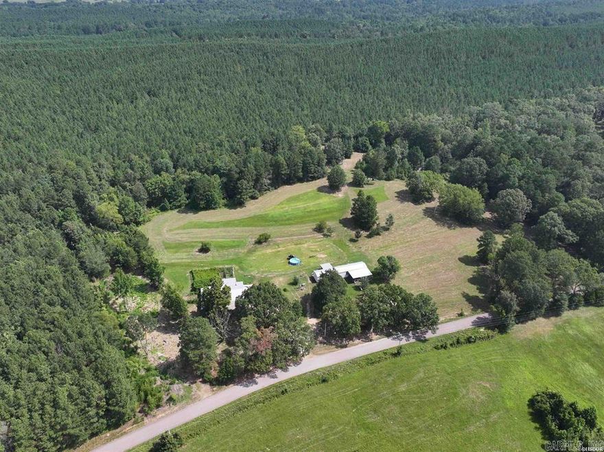 9.5 ± acre parcel in Amity! Property offers a large barn, a perfect garden spot, a small pond, and two sites with utilities in place and septic. Property is out of city limits but just a few minutes to town and amenities. This would be a great property for those looking to homestead or privacy!