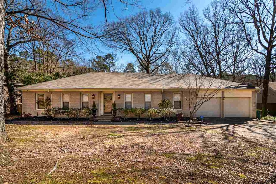 Adorable home in the heart of Little Rock! Enter into over-sized great room w/ a cozy wood burning fireplace. The kitchen is complete w/new granite, backsplash & fixtures. Each bathroom has new granite & fixtures. Most rooms have been freshly painted. Outside is a fabulous deck overlooking a huge private back yard backing up to green space & a work shop area under the home! The versatile floor plan includes a master suite, two additional rooms, full bath & bonus room. Perfect find! PLEASE SEE AGENT REMARKS