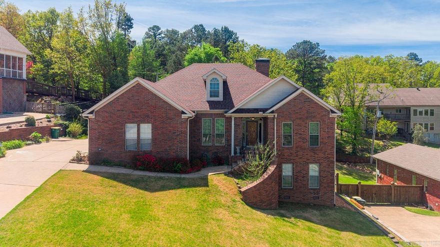 Welcome to life in The Ranch—one of West Little Rock’s most sought-after neighborhoods, offering a private lake for fishing and kayaking, scenic sidewalks, and a community park and playground. Ideally located off Highway 10, this home blends convenience with peaceful living. The main level features the heart of the home with a spacious living room anchored by custom built-ins, a well-appointed kitchen with abundant cabinet and countertop space, a defined dining room, and a beautifully detailed office with rich wood built-ins. The primary suite offers a true retreat with double vanities, two closets, and a spa-like feel. Downstairs, you’ll find two additional bedrooms and a full bath on a separate lower level—perfect for guests, kids, or added privacy. Enjoy stunning views of Pinnacle Mountain from the dining room and office, relax in the light-filled sunroom, or step outside to the multi-level back deck, partially covered for year-round enjoyment. This home offers the perfect blend of space, character, and lifestyle. Agents see remarks.