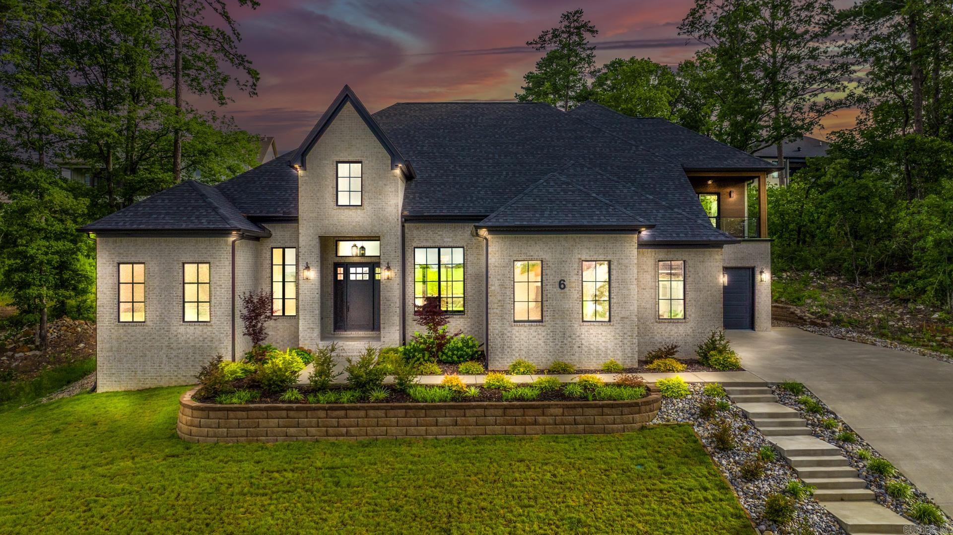With stunning views in Falstone, this brand-new 5 bed, 5.5 bath home on Haywood delivers space, style, and standout featuresāincluding a private home theater! Step into an impressive open plan with spacious dining, a grand living room with gas fireplace, built-ins, and sliding doors to your covered veranda and flat yard. The kitchen showcases waterfall quartz island, Monogram 5-burner gas stove, pot filler, convection ovens, 2 pantries, and locker station by the 3-car garage. The main-level primary suite features dual vanities, soaker tub, seated shower, and dual walk-ins. Two guest suites on the main level each have private baths and walk-ins. Upstairs you'll find a bonus room with covered balcony, wet bar with beverage cooler, full bath, Jack & Jill guest suites, and the high-end theater wired for surround sound. Pella Lifestyle windows and a high-efficiency TRANE system round it out. Come tour this Falstone beautyā6 Haywood Ct could be your next move!