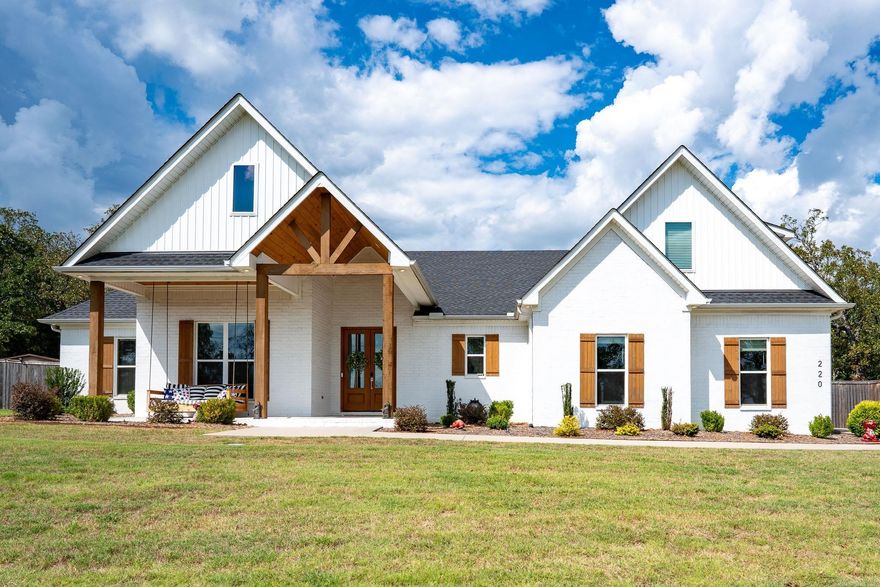 This stunning 5-bedroom, 3.5-bath home sits on 1.15 acres with beautiful views & privacy! A welcoming front porch w/tall ceilings opens into a bright foyer & inviting open-concept living, kitchen & dining area. The spacious living room features beautiful custom lighting & flows seamlessly into the gorgeous kitchen w/large island, beautiful countertops & backsplash, stainless steel appliances & impressive walk-in pantry w/extra counter space & storage & adjacent dining area. The primary suite is generously sized w/spa-like bath featuring soaking tub, dual vanities, custom-tiled walk-in shower & oversized walk-in closet with direct access to the laundry room. Three additional bedrooms on the main level share a well-designed hall bath w/double sinks & separate tub/shower area. Upstairs, the 5th bedroom or bonus room includes a full bath w/tiled walk-in shower. Outdoor living is just as impressive with a covered back porch featuring a wood-inlay ceiling, beautifully landscaped yard & spacious backyard offering privacy & tree-lined views. The home also includes a two-car garage w/additional storage.