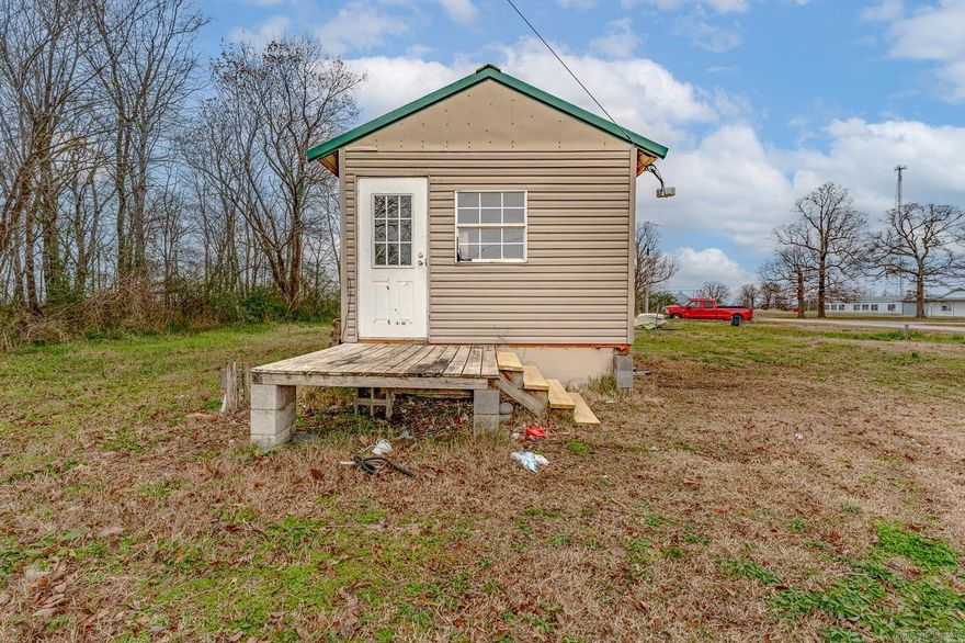 Welcome to Market 420 Oakwood Avenue of the OT McDougal Subdivision in McDougal, Arkansas. Situated on a .34 +/- acre level lot is a 12x24 Tiny Home with 8x6 wood deck and 8x10 storage building. The home is wrapped in taupe vinyl, topped with a green metal roof, and offers low-maintenance living in a rural setting. The interior offers 288 sf of well laid out efficiency living space and features an open concept living/kitchen/dining/bedroom area and private bathroom w/ walk-in shower, vanity, and commode. Conveniently located near Black River WMA and White Oaks Duck Woods and only 35 miles to Paragould, AR and 55 miles to Jonesboro, AR. Call today to make this tiny house your home, home away from home, or next addition to your rental portfolio.