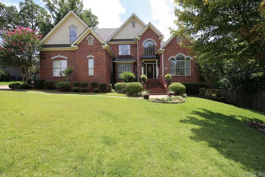 Gorgeous home in Chenal Valley.  Two story foyer entry, beautiful crown molding and open floor plan. Chef's kitchen with slab granite, travertine floors & double ovens opens to hearth room & dining space. Main also features formal LR, dining rm, laundry and large master retreat w/luxurious bath & sitting area. 3 large bedrooms, bonus (could be 4th bdrm) and bath upstairs. Screened in porch overlooks yard w/water feature, deck w/built in seating & gas hookup. Walk-in storage under the house.  Come See!