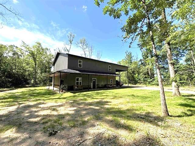 Barndominium style charm meets modern comfort in this spacious 4-bedroom, 3-bath, two-story home in the Jessieville School District! With approx. 2,800 sq ft, this unique property features a game room, office, mudroom, and an open living area ideal for entertaining. The kitchen and dining room showcase stunning tongue-and-groove wood ceilings, adding warmth and character. Upstairs, enjoy a cozy loft and balcony perfect for relaxing with a view. The master bed/bath offers a luxurious whirlpool tub for unwinding. The home sits on 13.09 scenic acres with a beautiful creek that flows into a stocked pond perfect for fishing or simply enjoying nature. A two-car carport and central heating & cooling add convenience and comfort. This one-of-a-kind property combines rustic style with modern amenities donāt miss your chance to own this beautiful property!