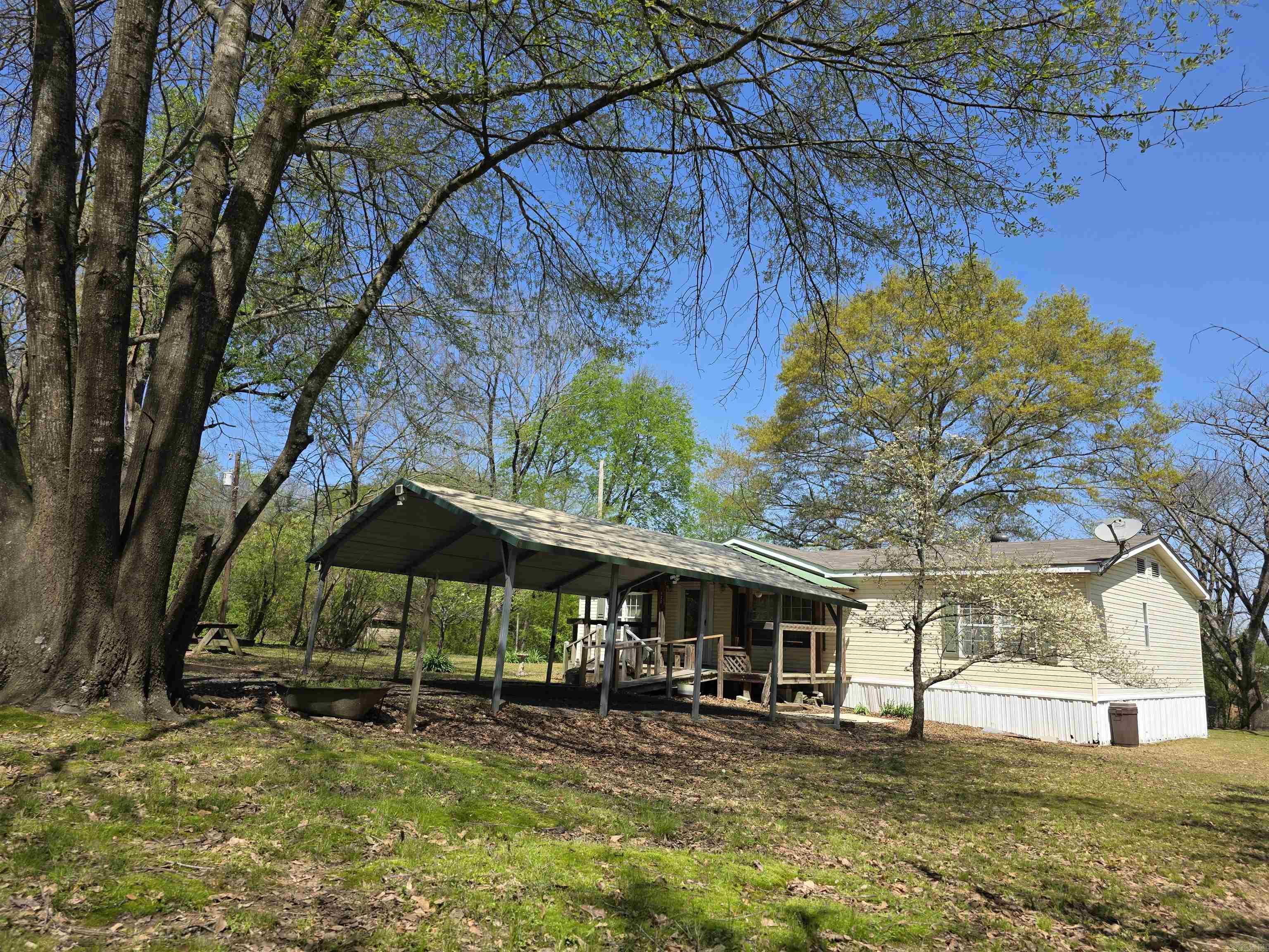 Donāt miss this incredible chance to own a one-acre lot right in downtown Hatfield! This spacious double-wide home offers three comfortable bedrooms and two full bathrooms, built in 2000. The property boasts recent upgrades, including a brand-new HVAC unit installed in 2024 and a new roof, ensuring peace of mind for years to come. Enjoy all-electric living, with plumbing already set up for a propane stove if you prefer. The location couldnāt be better, as youāll be just a short distance from area cafes, a convenience store, the post office, city hall, and the fire station. Additional highlights include a two-car carport, a charming covered front deck, an old well, and lush shade trees that enhance the outdoor space. This home offers a perfect blend of comfort and convenience! Agent please see remarks