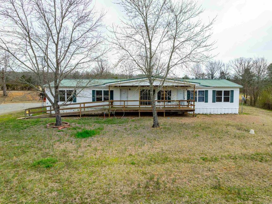 This home has breathtaking views of a large pond in a charming rural setting perched on a hill.  With five bedrooms, there is plenty of room for your large family.  Enjoy grilling out back watching the sunset from your hill.  Survey to provided with 2 +/- acres to convey with part of the pond being included.