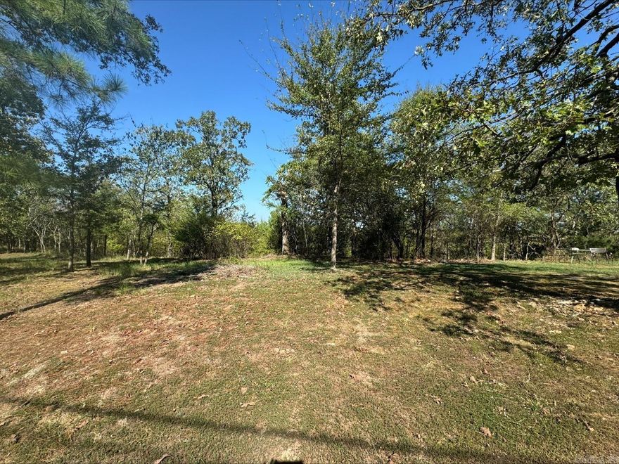 Beautiful mountain top lot overlooking Lake Hamilton.  Once cleared, the views will be amazing!  Survey shows 252 feet of lake front.  City utilities available.
