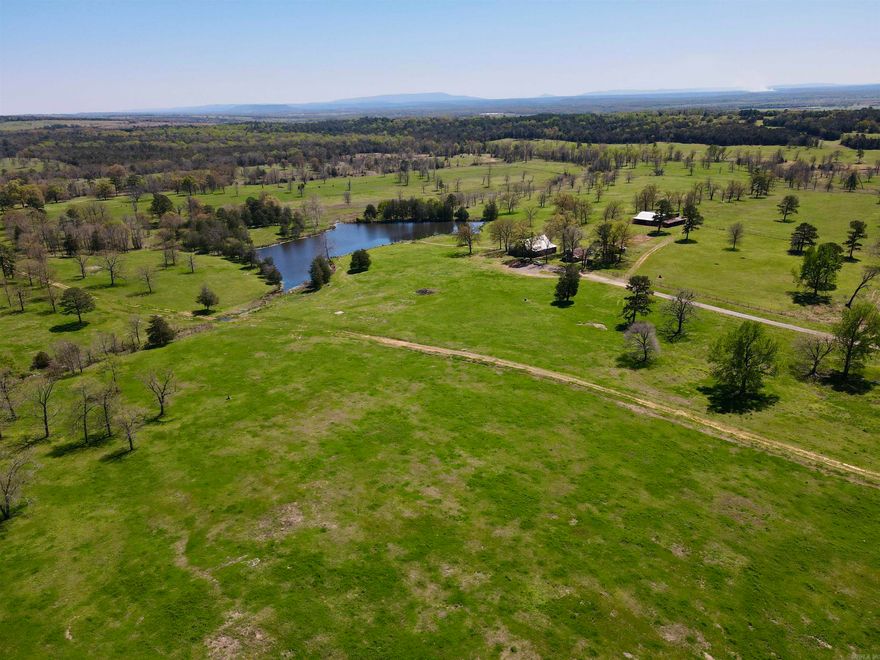 Beautiful cattle farm with a house and all of the infrastructure in place to start your own cattle farm, or add to your current cattle operation. Outstanding location just 20 miles from I-40!  825+- acre farm with high percent grass / open ground and cross fencing for your rotational grazing operation. There are 10 pastures with all having a water source through a pond or live water. Onion Creek as well as many springs run through the property for year round fresh water.  Infrastructure:  -2,800 sq. ft. m/l log cabin. -40' x 50' horse barn with two 10' overhangs on each side. -60' x 80' shop with a 25' lean-to. -Manufactured steel pole barn for hay storage. -Working pens w/ large attached additional hay storage. -Horse arena. -40 acre m/l pipe fence pasture with pond that includes working pens and a head gate. -13 acre m/l pipe fence weaning pen with 1,000 gallon fresh water trough. -6 acre m/l bull pen with pond. -3 acre m/l horse pasture. -3 acres m/l pipe fence with 1,000 gallon fresh water trough. -2 acre m/l holding pen. -1 acre m/l riding arena. -Running water in all of the catch pens.