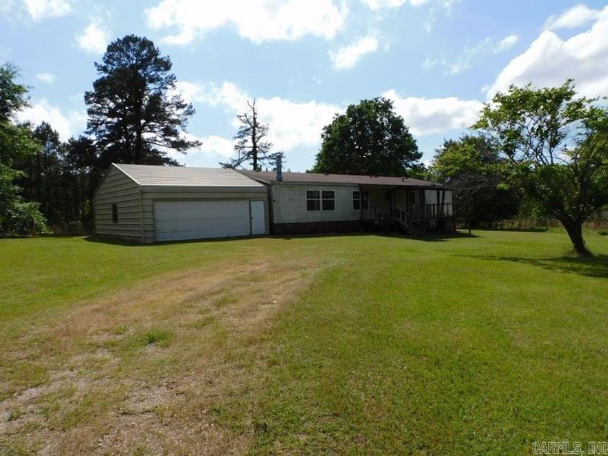 Double Wide Manufactured Home built in 2000 with approximately 3.04 acres and conveniently located within the Glen Rose School District. Home features 3 bedrooms, 2 full bathrooms, 1815 sq. ft., open front porch, deck, detached utility building for parking and or a shop. Spacious kitchen dining combo, den with fireplace and living room, HUD Case #031-302555, FHA Financing: IE (Insured Escrow). Property is sold in as-is condition, no warranties, guarantees or representations.