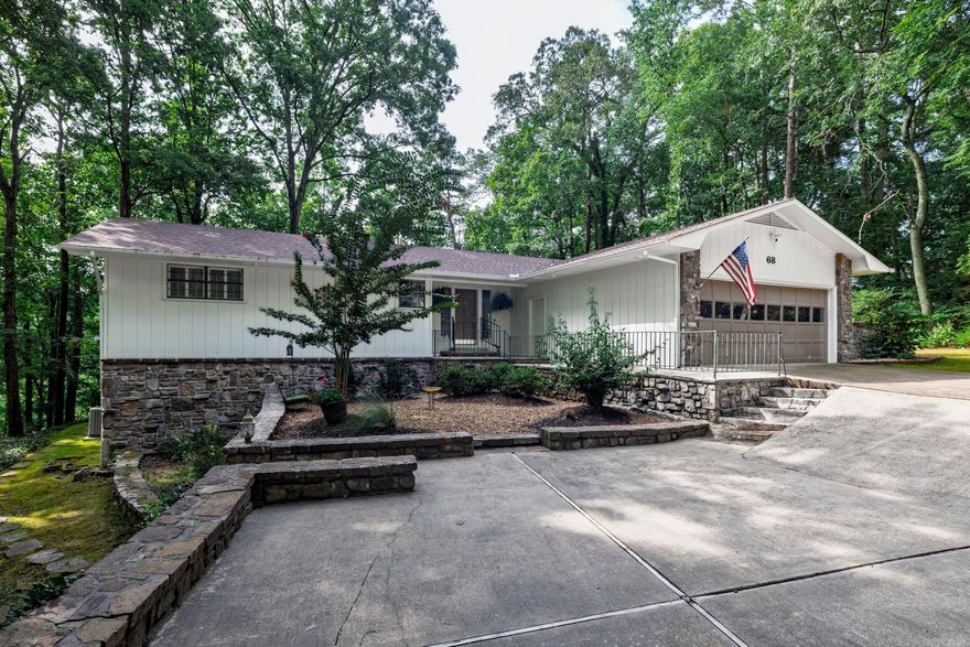 Beautiful and unique setting near the West Gate, common to the Desoto Golf Course. This well-maintained and updated home provides privacy in a serene setting. Enjoy the forested setting from the expansive deck and patio. Updates include a remodeled kitchen with new cabinets, appliances and granite countertops. Freshly painted exterior and interior. All appliances convey. New roof and Leaf Filters on gutters in 2023. Heat pump 2021. Hot Springs Village has a one-time buy-in fee of $2,000 paid at closing.